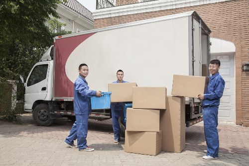 A professional moving truck in Canary Wharf skyline